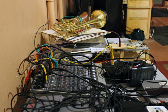 A typical table of music gear at an experimental music concert